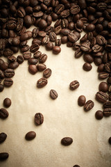 Coffee beans on vintage paper background