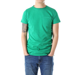 Young man in blank green t-shirt on white background, close up