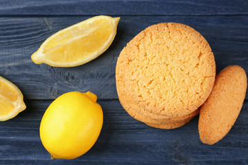 Composition of cookies and lemons on wooden background
