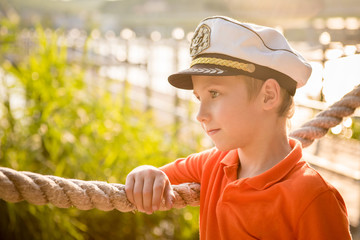 Beautiful boy is about rope in the captain's cap