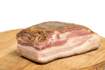 Board of raw pork meaty bacon on the wooden board