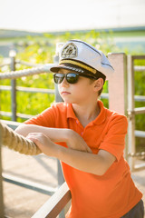 Beautiful boy is about rope in the captain's cap