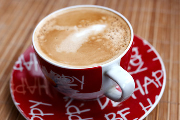 Cup of coffee on saucer. Delicious freshly prepared aromatic coffee in the coffee machine