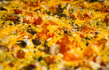 big yellow and red pizza background close up