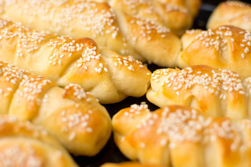 Homemade pastry on black baking pan