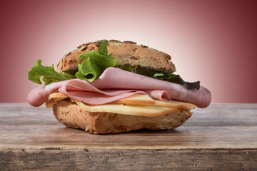 bread stuffed with mortadella, salad and cheese