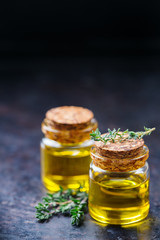 Organic essential thyme oil with green leaves
