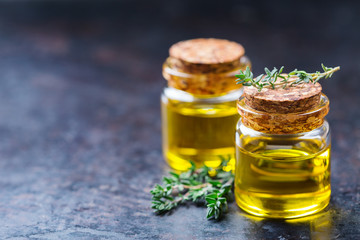 Organic essential thyme oil with green leaves