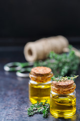 Organic essential thyme oil with green leaves