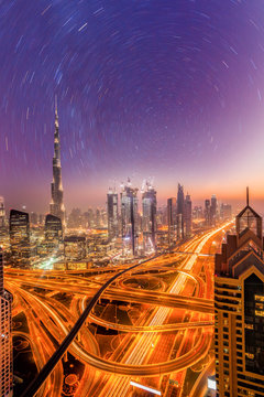 Dubai city at night under a starry sky in United Arab Emirates