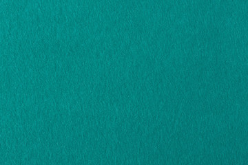 Aqua color felt background for design.
