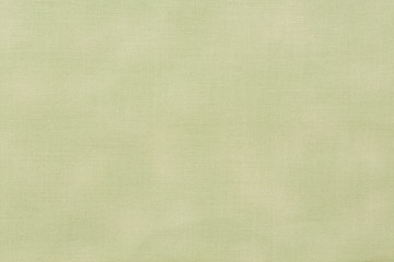 Light green fabric texture background.