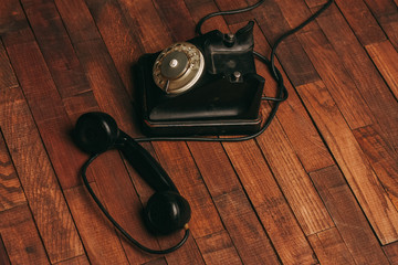 wired phone on a wooden background