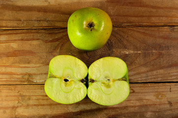 Green apple on a wooden table