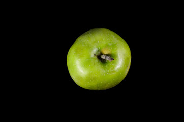 Green apple isolated on black