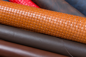 Many multicolored leather pieces for sale.