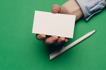 business card pen on a green and yellow background
