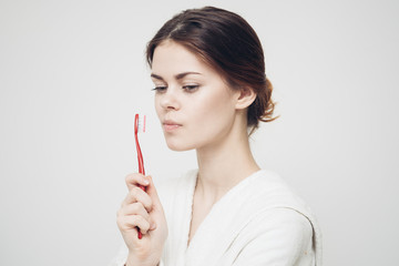 woman with red toothbrush