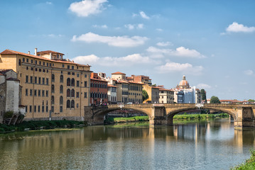 Fototapeta na wymiar travel to Italy - Arno River with Ponte alla Carraia bridge in Florence city