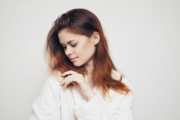 girl with a comb in his hand on a white background distressed hair