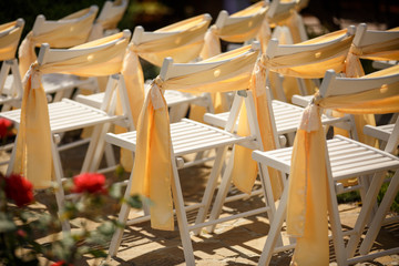 Wedding decoration, chairs with golden decor for beautiful wedding ceremony
