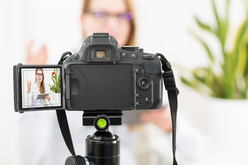 Video camera blog recording. Vlog blogger woman.