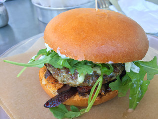 Hamburger with pickles in restaurant