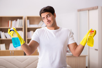 Man husband cleaning the house helping wife