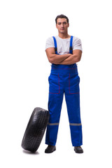 Handsome tyre repairman isolated on white