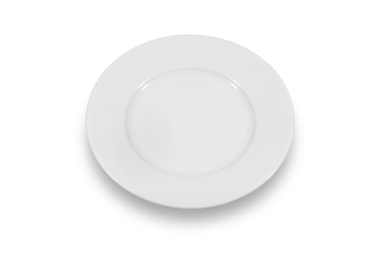 Flat white shallow porcelain plate with wide shoulders on white background from high angle