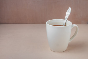 Cup of cacao on a wooden table.