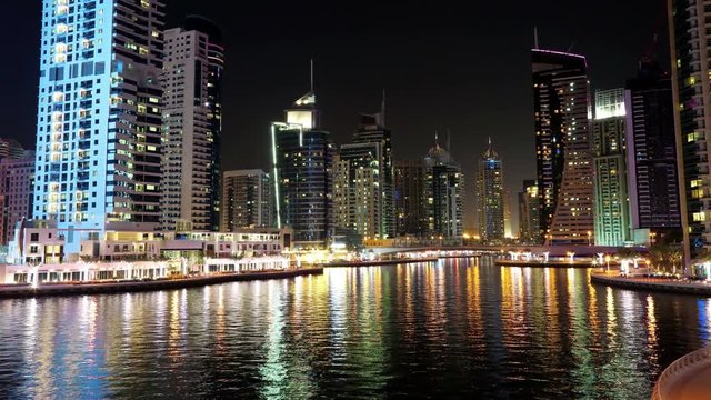 UHD 4K Dubai Marina night time lapse, United Arab Emirates. Dubai Marina - largest man-made marina in world. Dubai Marina is a canal city, carved along a 3 km stretch of Persian Gulf shoreline