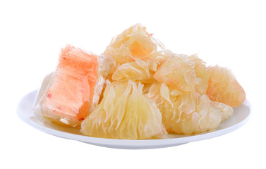 Grapefruit in white plate isolated on white background