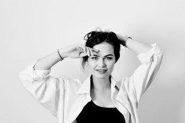 Naklejka premium attractive model is posing in shirt on white background
