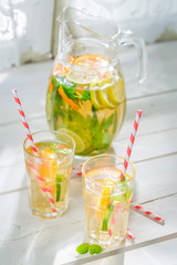 Healthy lemonade with fruits with in old kitchen