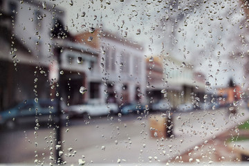 Raindrops on a window looking at an Old Sacramento Street