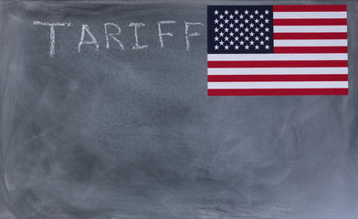Fototapeta na wymiar Chalkboard with writing of tariff and United States flag