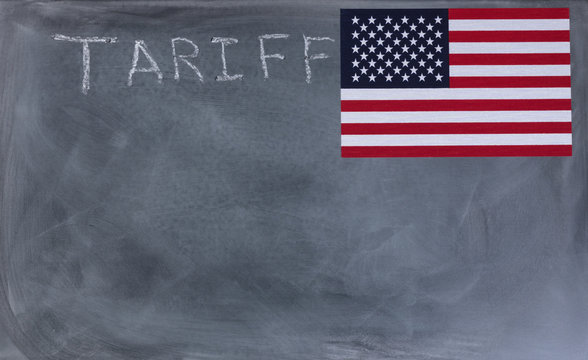 Chalkboard with writing of tariff and United States flag