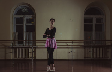 Ballet. Dancer warming up in the hall.