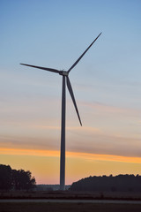 Fototapeta na wymiar Silhouette of wind turbine on sunset