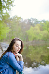 beautiful girl in a dress in the spring in a mask of dry leaf