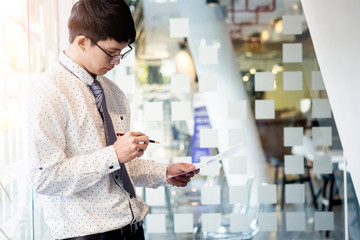 Young businessman reviewing documents conference Working Plannin