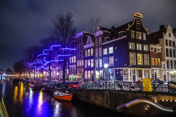 Zelfklevend Fotobehang AMSTERDAM, NETHERLANDS - JANUARY 12, 2017: Beautiful night city canals of Amsterdam. January 12, 2017 in Amsterdam - Netherland. © Unique Vision