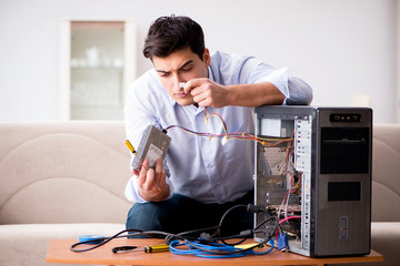 Frustrated man with broken pc computer