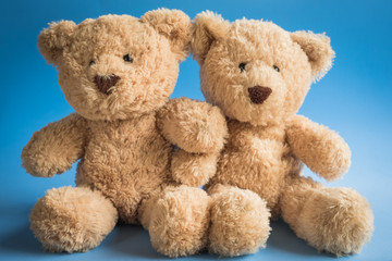 teddy bear on a plain colored background