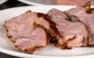 Smoked raw chicken meat, steak-like slices ready to go onto the grill