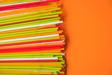 Fototapeta premium Colorful drinking straws for the color background. Abstract a colorful of plastic straws used for drinking water or soft drinks