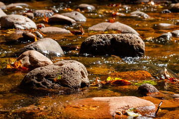Fresh flowing water around large stones