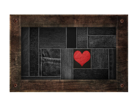 Old wooden frame with denim jean sewing pattern with red heart, isolated on white background - Powered by Adobe
