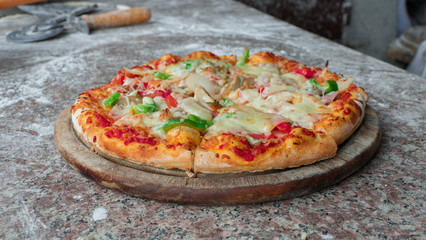 Close up Italian Pizza in wooden plate